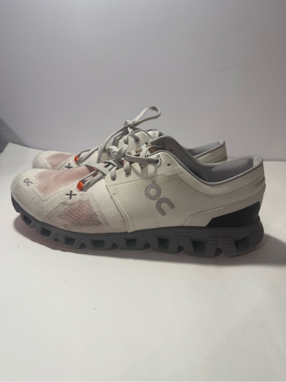Light Gray Athletic Sneakers with Subtle Orange Accents